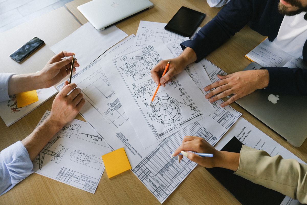Illustrative stock photograph of colleagues reviewing working documents